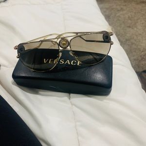 Versace gold logo sunglasses new! Never worn and beautiful